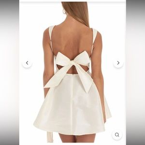 cream dress with bow in the back